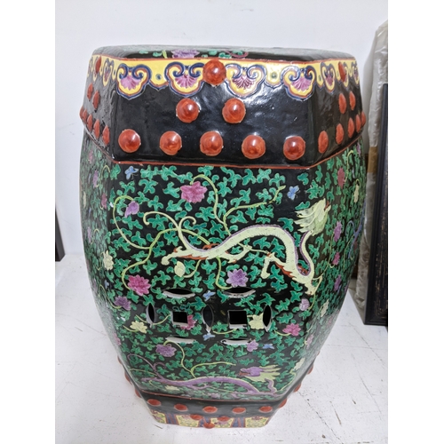 25 - A late 20th century Chinese porcelain garden seat A/F, and a Chinese fish bowl decorated with iris' ... 