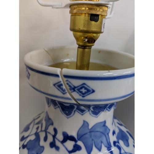 2 - Three modern table lamps decorated in blue and white, two raised on circular plinths and one on a sq... 