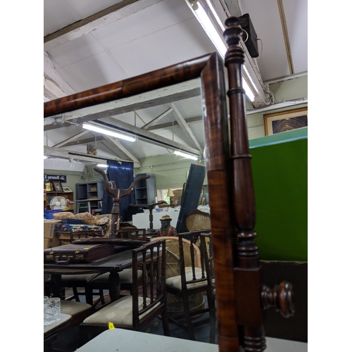 41 - A late Victorian mahogany dressing table mirror with turned finials and supports on a base with a ri... 