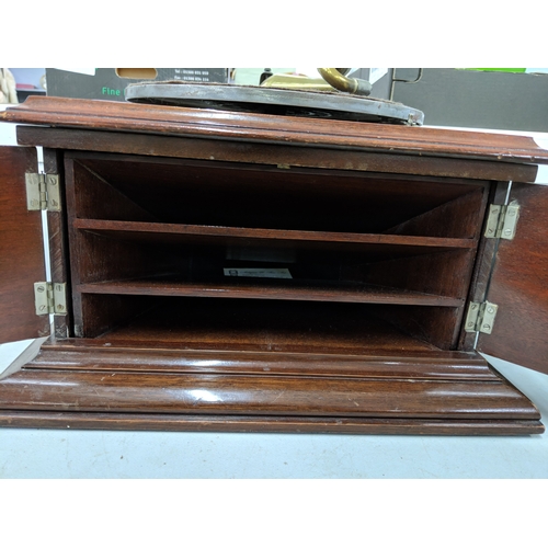 43 - An early 20th century oak cased gramophone with a pair of hinged doors to the front and a modern bla... 