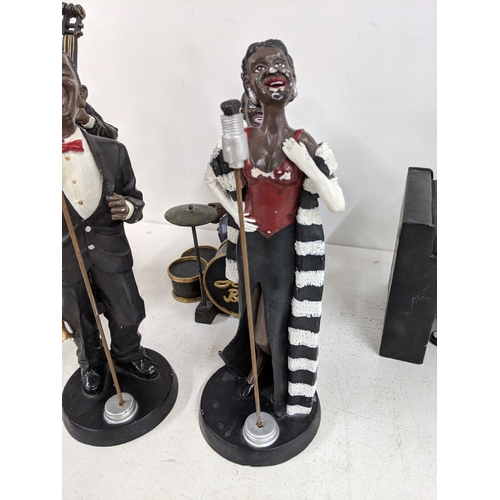52 - Five jazz band figurines to include, two signers, a pianist a drummer and a double bass player A/F
L... 