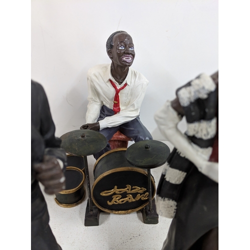 52 - Five jazz band figurines to include, two signers, a pianist a drummer and a double bass player A/F
L... 