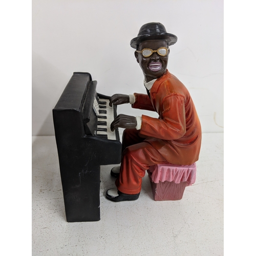 52 - Five jazz band figurines to include, two signers, a pianist a drummer and a double bass player A/F
L... 