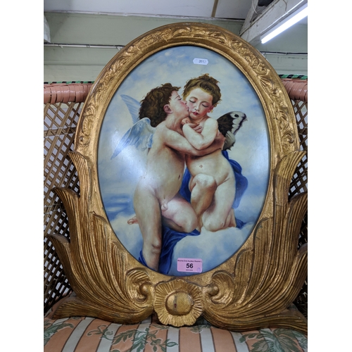 56 - Three items of small furniture to include a plate rack, a print of two cherubs and a carved chair
Lo... 