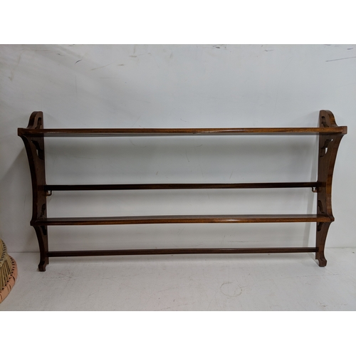 56 - Three items of small furniture to include a plate rack, a print of two cherubs and a carved chair
Lo... 