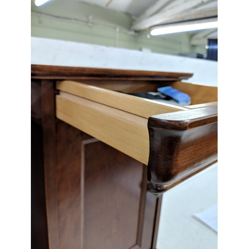 58 - A pair of modern bedside cabinets with a single drawer over a panelled door
Location: A4M
If there i... 