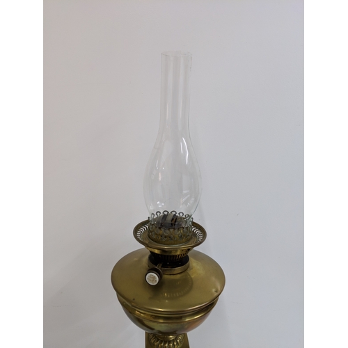 27 - A Victorian brass oil lamp with a glass funnel and a Victorian barometer on an oak stand A/F
Locatio... 