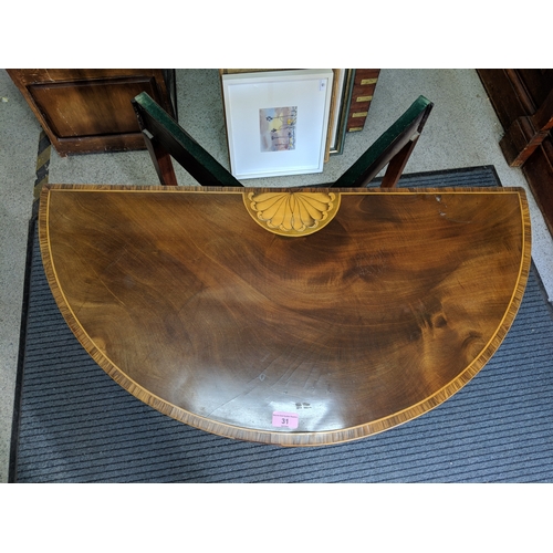 31 - ***THIS LOT HAS BEEN WITHDRAWN***A George III inlaid mahogany fold over card table
Location: FOYER
I... 