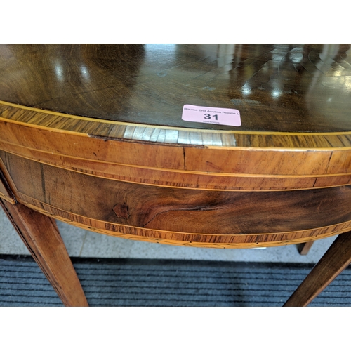 31 - ***THIS LOT HAS BEEN WITHDRAWN***A George III inlaid mahogany fold over card table
Location: FOYER
I... 