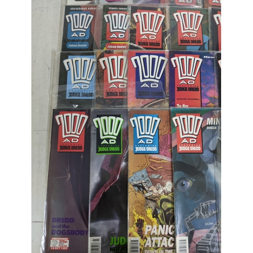31 - A large quantity of mainly 1990's 2000AD magazines, mostly featuring Judge Dread, all in protective ... 