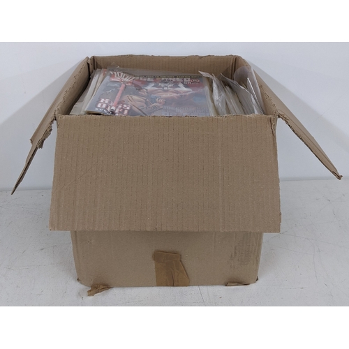 31 - A large quantity of mainly 1990's 2000AD magazines, mostly featuring Judge Dread, all in protective ... 