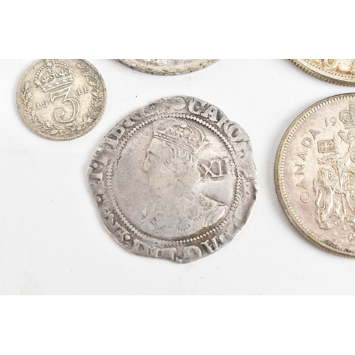 25 - A group of six coins to include a Charles I (1625–1649) hammered silver shilling, having triangle in... 
