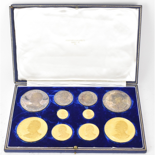 A cased commemorative set of Albert Schweitzer medallions by Gregory and Co. Ltd, comprising six gold medallions struck in 22ct gold and four medallions in silver, each bearing a portrait of Albert Schweitzer (1875–1965) with legend and dates, the reverse of each featuring the Albert Schweitzer Hospital which he founded in Lambarènè, housed in a fitted blue velvet-lined presentation case with certificates, combined silver weight 212.9 grams, combined gold weight 381.2 grams