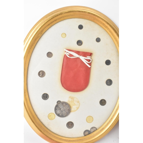 12 - The Royal Maundy 1959 - A framed set of 14 coins and red purse issued at the Royal Maundy service at... 