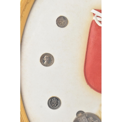 12 - The Royal Maundy 1959 - A framed set of 14 coins and red purse issued at the Royal Maundy service at... 