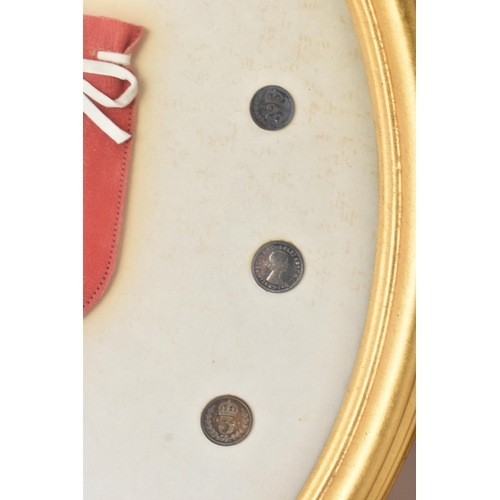 12 - The Royal Maundy 1959 - A framed set of 14 coins and red purse issued at the Royal Maundy service at... 