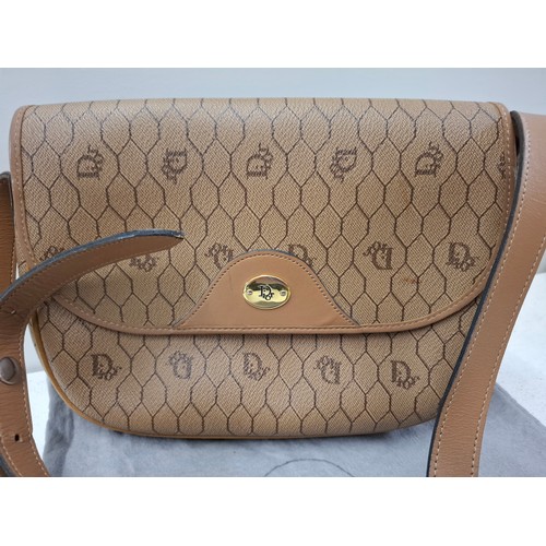 Christian Dior- A 1990's Bobby light brown honeycomb and monogram shoulder bag having gold tone hardware and branded dust bag. Location:
If there is no condition report, please request