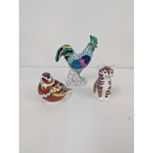 Three decorative small items to include Herend hand painted rooster along with two Crown Derby paperweights to include a cat (missing stopper) and bird with silver topper
Location:4.1
If there is no condition report shown, please request