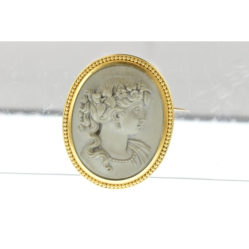 13 - A 19th century cameo brooch, the oval grey lava panel carved in high relief with the profile of a cl... 