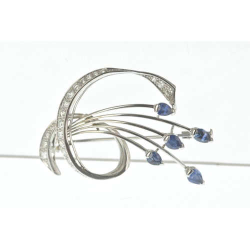 15 - A sapphire and diamond 18ct white gold brooch, of floral spray design set with pear-cut sapphires to... 