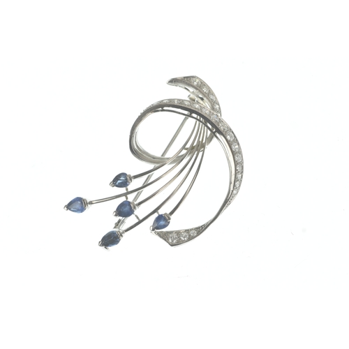 15 - A sapphire and diamond 18ct white gold brooch, of floral spray design set with pear-cut sapphires to... 