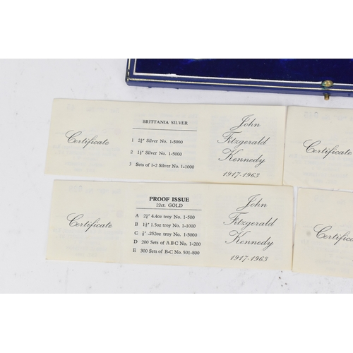 16 - A cased commemorative set of John F Kennedy medallions by Gregory and Co. Ltd, comprising six gold m... 
