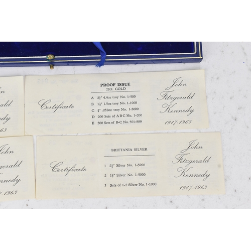 16 - A cased commemorative set of John F Kennedy medallions by Gregory and Co. Ltd, comprising six gold m... 