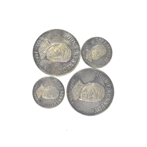 16 - A cased commemorative set of John F Kennedy medallions by Gregory and Co. Ltd, comprising six gold m... 