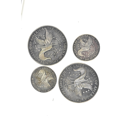 16 - A cased commemorative set of John F Kennedy medallions by Gregory and Co. Ltd, comprising six gold m... 