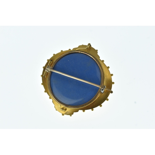 21 - A Victorian yellow gold mourning brooch, set with a central pearl in a star formed setting with blue... 