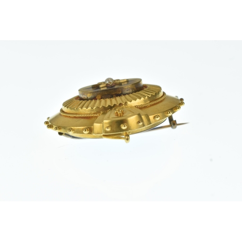 21 - A Victorian yellow gold mourning brooch, set with a central pearl in a star formed setting with blue... 