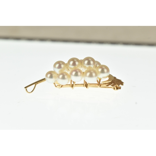 23 - A cultured pearl set 14ct gold spray brooch, designed as a stylised abstract foliate spray with text... 