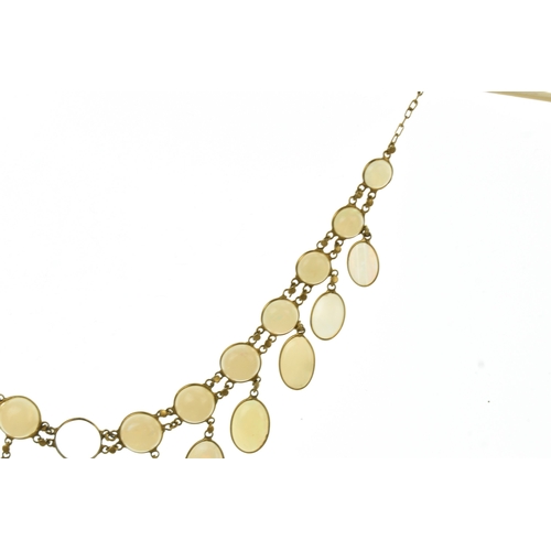 28 - An opal 9ct gold opal necklace, set with twenty-six graduated oval cabochon opals  individually beze... 