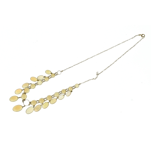 28 - An opal 9ct gold opal necklace, set with twenty-six graduated oval cabochon opals  individually beze... 