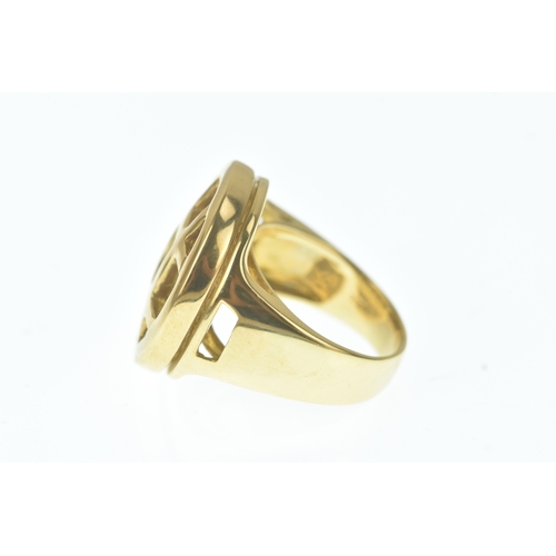 29 - A modern 18ct gold and mother-of-pearl ring, in the Cartier design, the domed oval mother-of-pearl p... 
