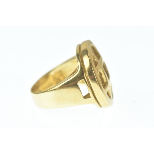 29 - A modern 18ct gold and mother-of-pearl ring, in the Cartier design, the domed oval mother-of-pearl p... 