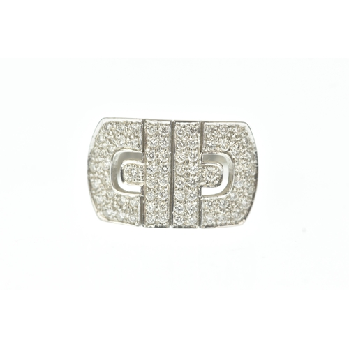 30 - A diamond 18ct white gold ring, in the Bulgari design, the wide rectangular face pavé-set with brill... 