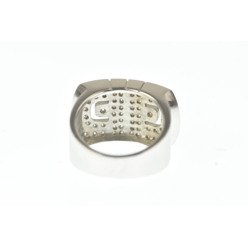 30 - A diamond 18ct white gold ring, in the Bulgari design, the wide rectangular face pavé-set with brill... 