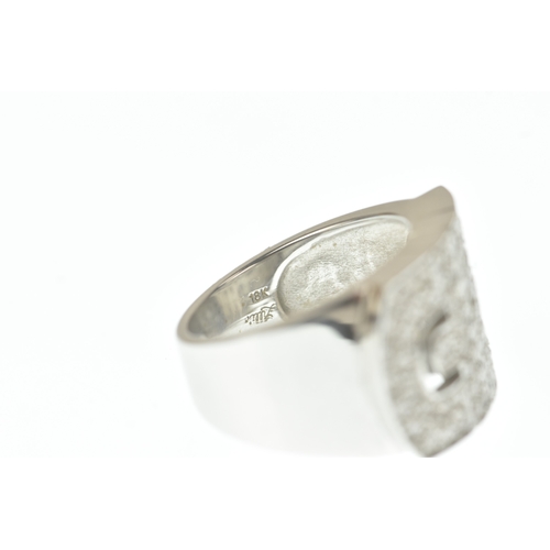 30 - A diamond 18ct white gold ring, in the Bulgari design, the wide rectangular face pavé-set with brill... 