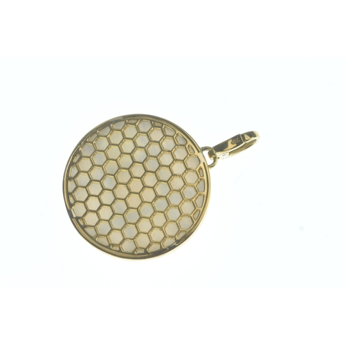 32 - A modern 18ct gold and mother-of-pearl pendant, in the Cartier design, the domed oval mother-of-pear... 