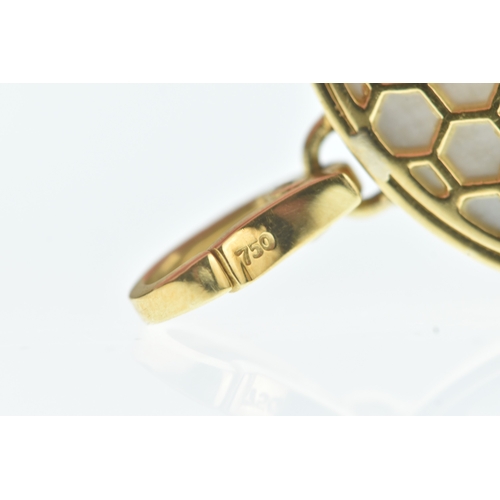 32 - A modern 18ct gold and mother-of-pearl pendant, in the Cartier design, the domed oval mother-of-pear... 