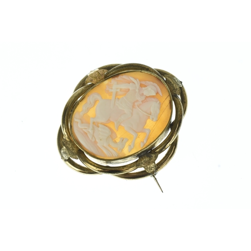 35 - A Victorian carved shell cameo gold plated brooch, depicting St George slaying the dragon, the oval ... 