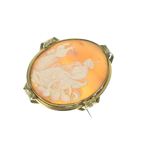 36 - A Victorian carved shell cameo gold plated brooch, depicting Hera (Juno) seated in a chariot drawn b... 