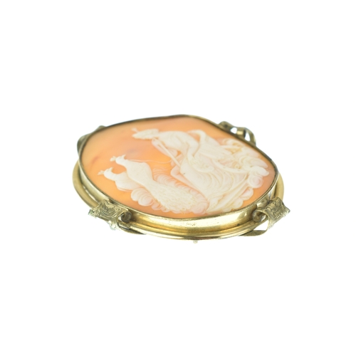 36 - A Victorian carved shell cameo gold plated brooch, depicting Hera (Juno) seated in a chariot drawn b... 