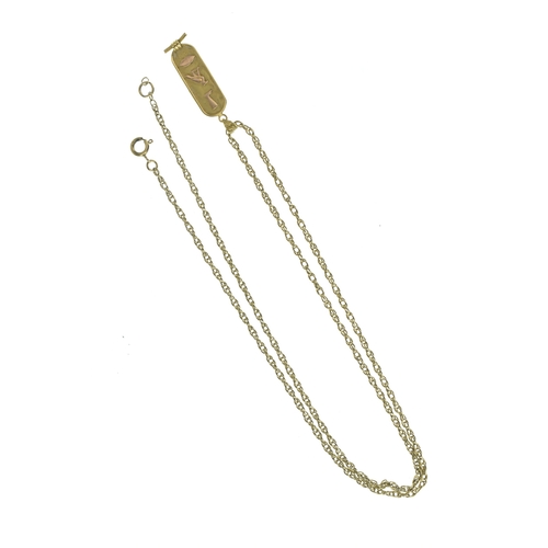 39 - A 9ct yellow gold twisted chain link necklace and a yellow metal Egyptian-style cartouche pendant, t... 