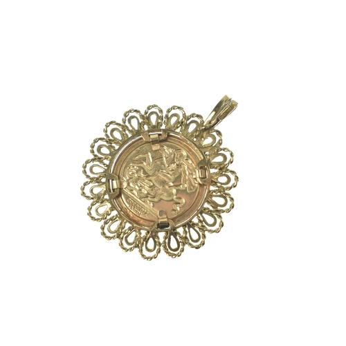 48 - A 9ct yellow gold pendant, inset with a gold plated St George Medal coin, surrounded by a pierced ro... 