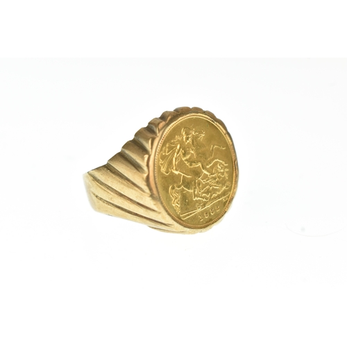 50 - A 9ct gold gents ring, inset with a 1982 half sovereign, with an incised mount, ring size S 1/2, 11.... 