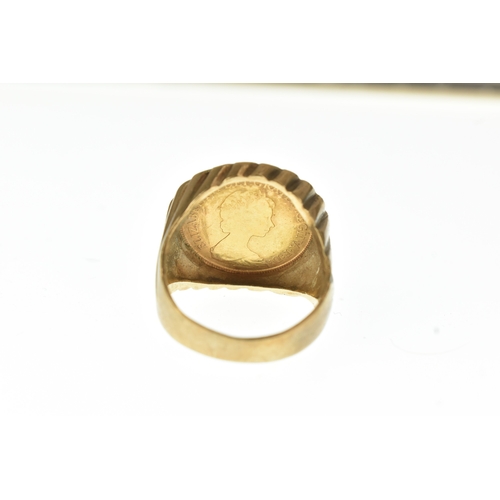 50 - A 9ct gold gents ring, inset with a 1982 half sovereign, with an incised mount, ring size S 1/2, 11.... 