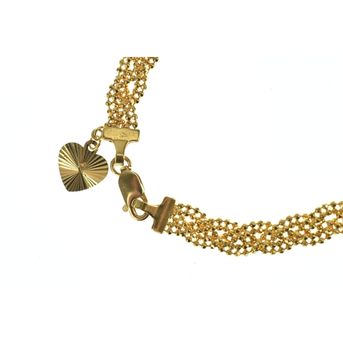 52 - A 22ct gold beaded mesh bracelet, having textured spherical links with lobster clasp, stamped 916, 1... 