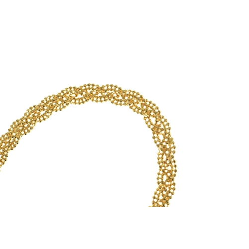 52 - A 22ct gold beaded mesh bracelet, having textured spherical links with lobster clasp, stamped 916, 1... 